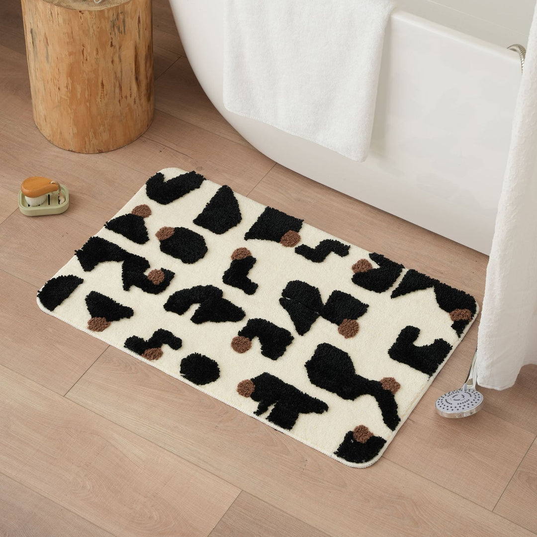 Tufted bathroom mat in abstract leopard pattern with soft high pile Stornfield