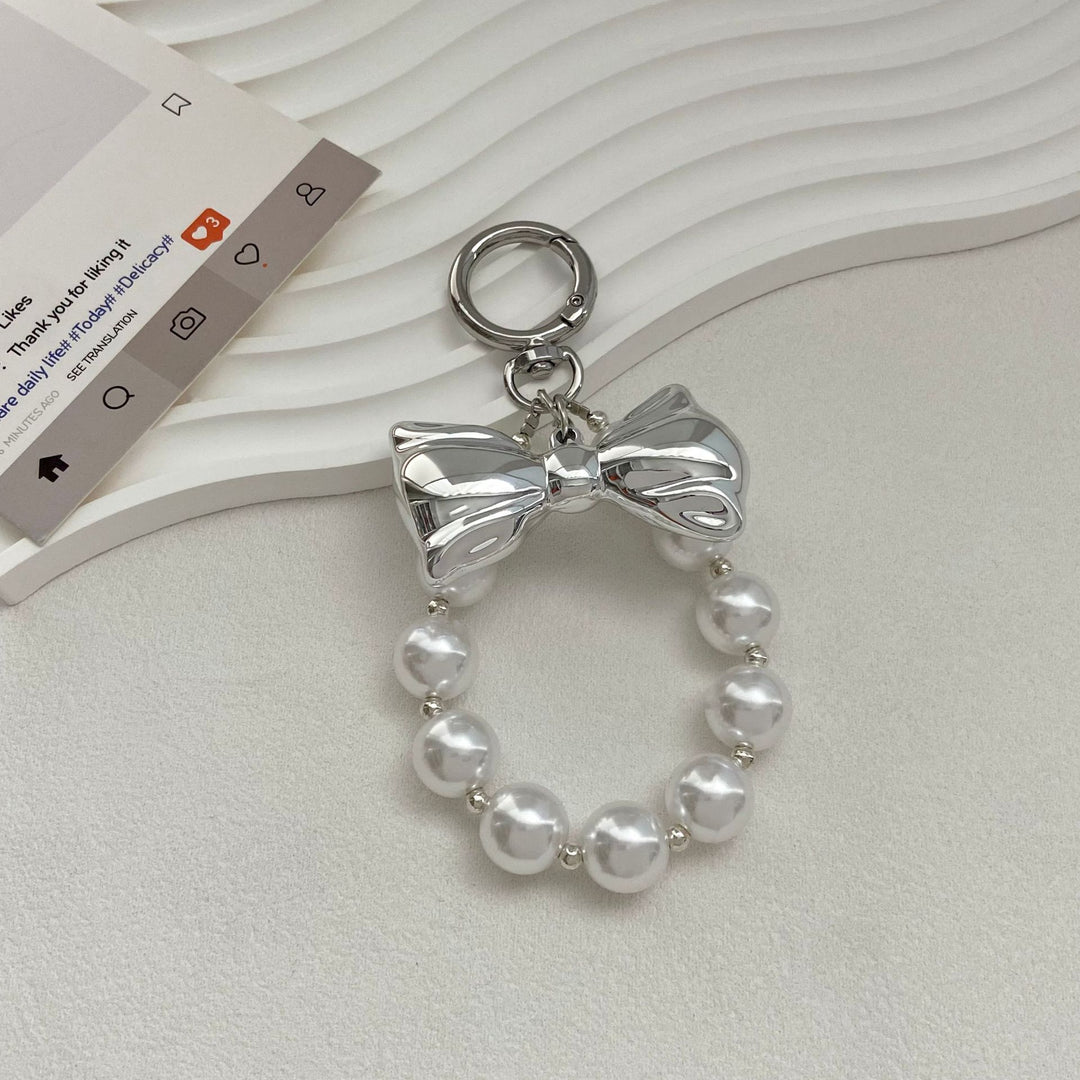 Elegant Pearl Bow Keychain Stornfield
