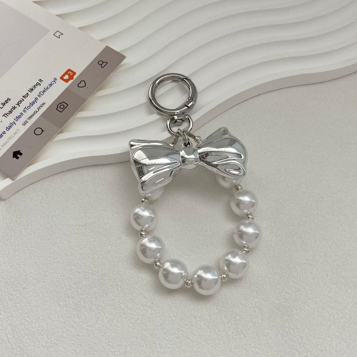 Elegant Pearl Bow Keychain Stornfield