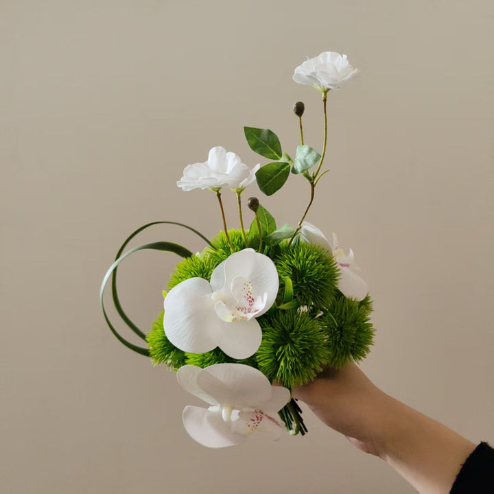Lifelike Orchid and Greenery Floral Arrangement