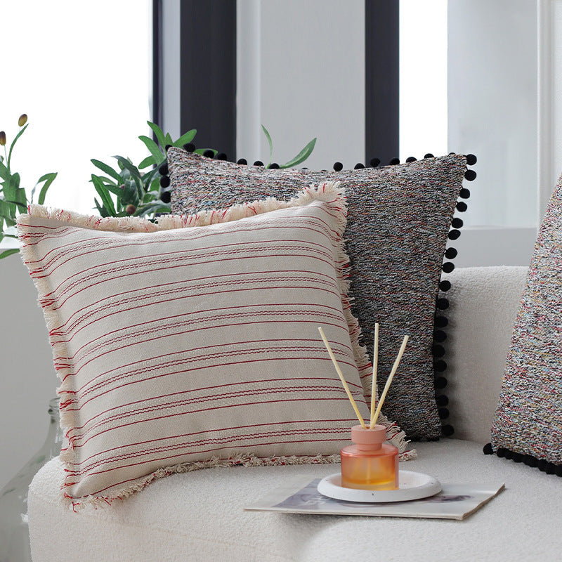 Playful decorative cushion with tassel edge