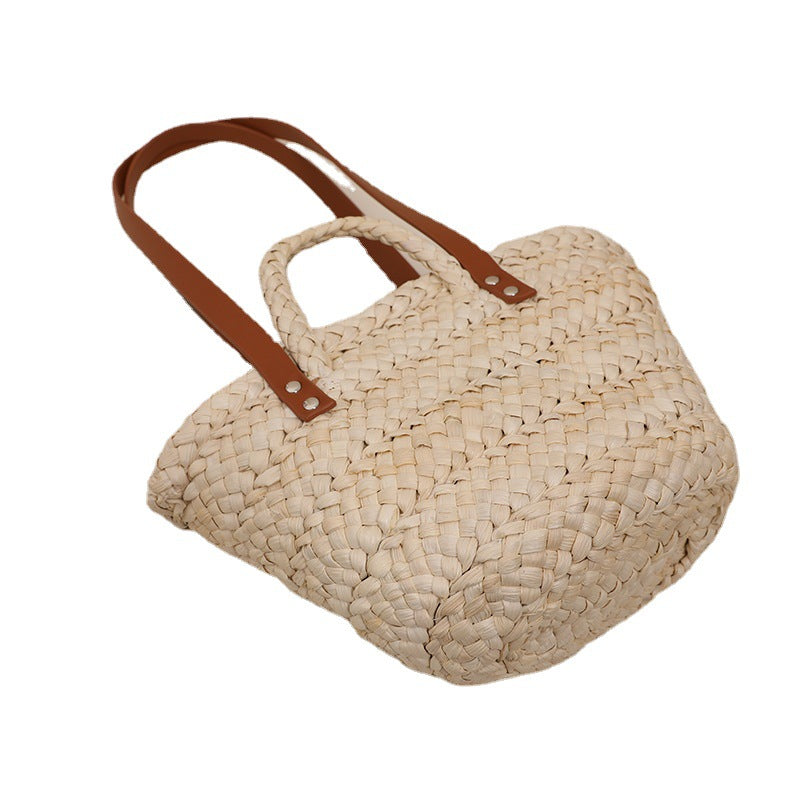 Handcrafted straw bag with sturdy leather handles Stornfield