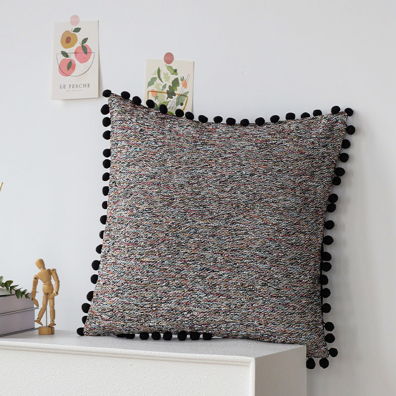 Playful decorative cushion with tassel edge