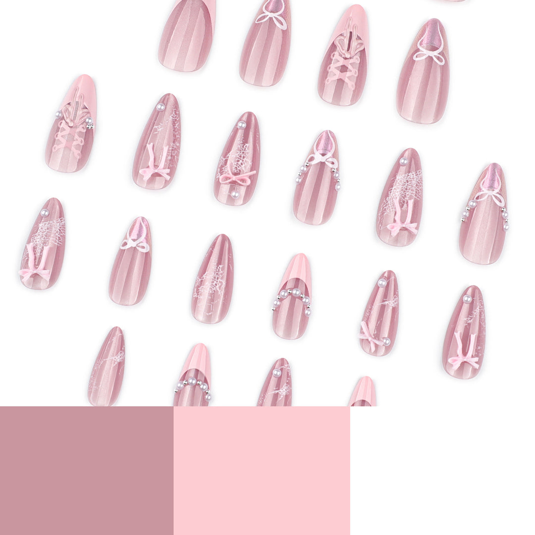 Artful nail extensions with delicate bow motifs Stornfield