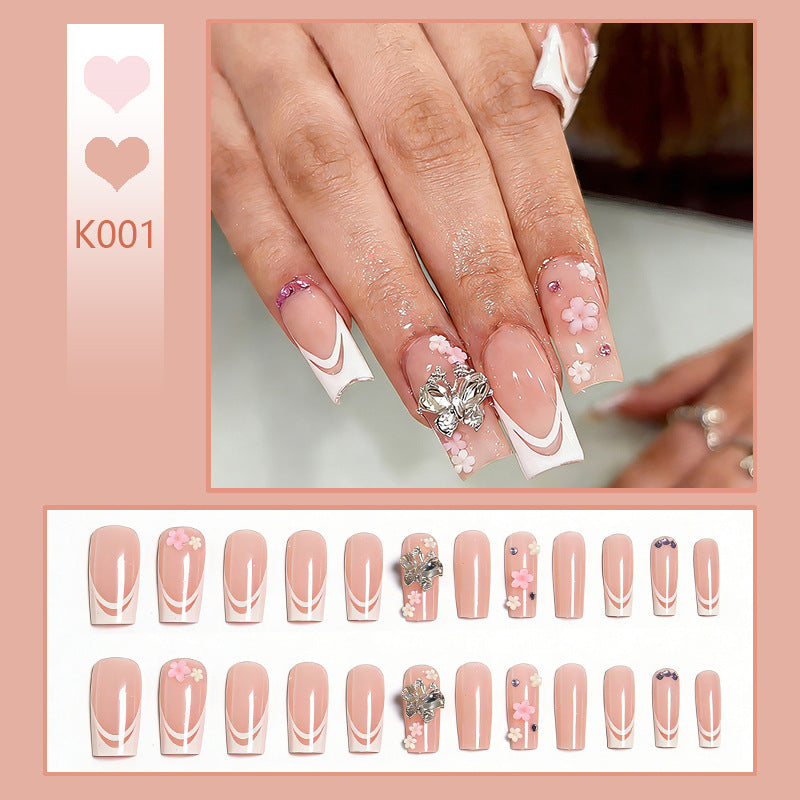 Artificial nails with floral accents and glitter effects Stornfield
