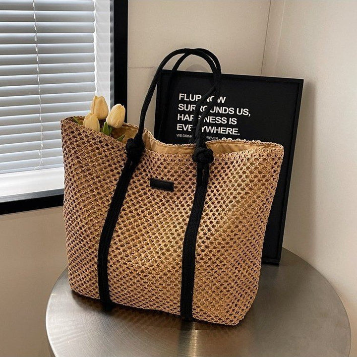 Beach bag made of hand-woven natural material with sturdy handles Stornfield