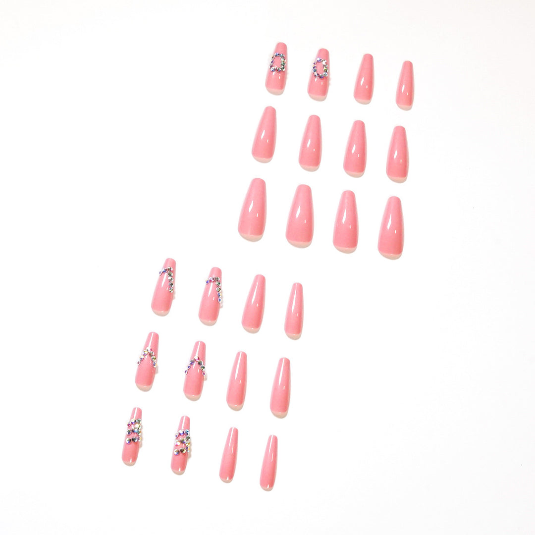 Artificial nail extensions with elegant rhinestone embellishments Stornfield