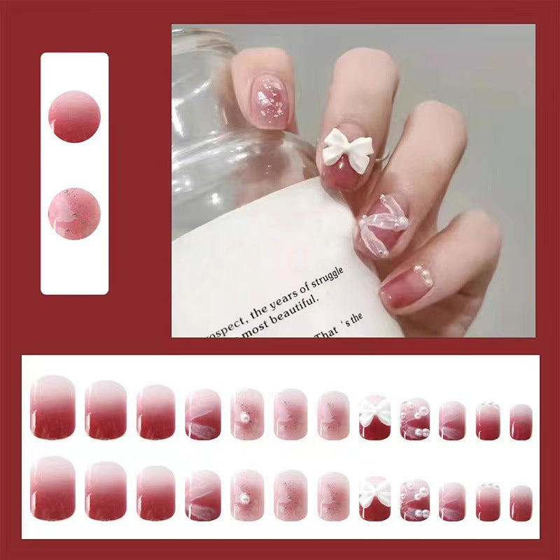 Creative art nails with bows and pearl coating Stornfield