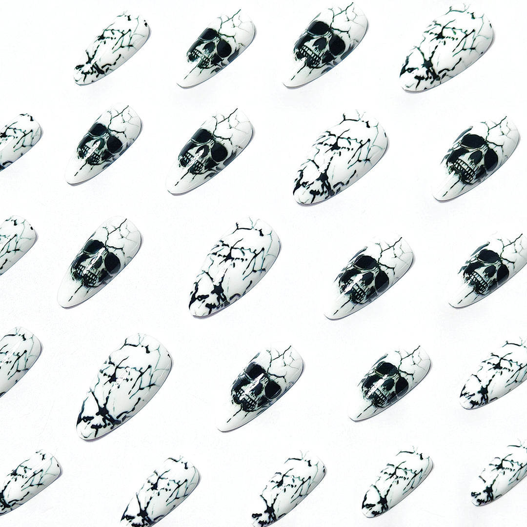 Artificial nails with playful skull design and crackle effects Stornfield