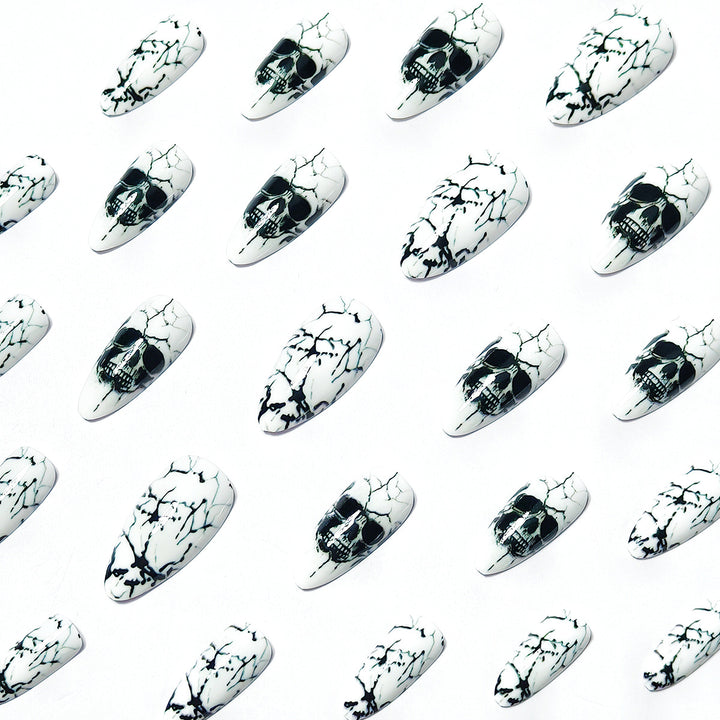 Artificial nails with playful skull design and crackle effects Stornfield