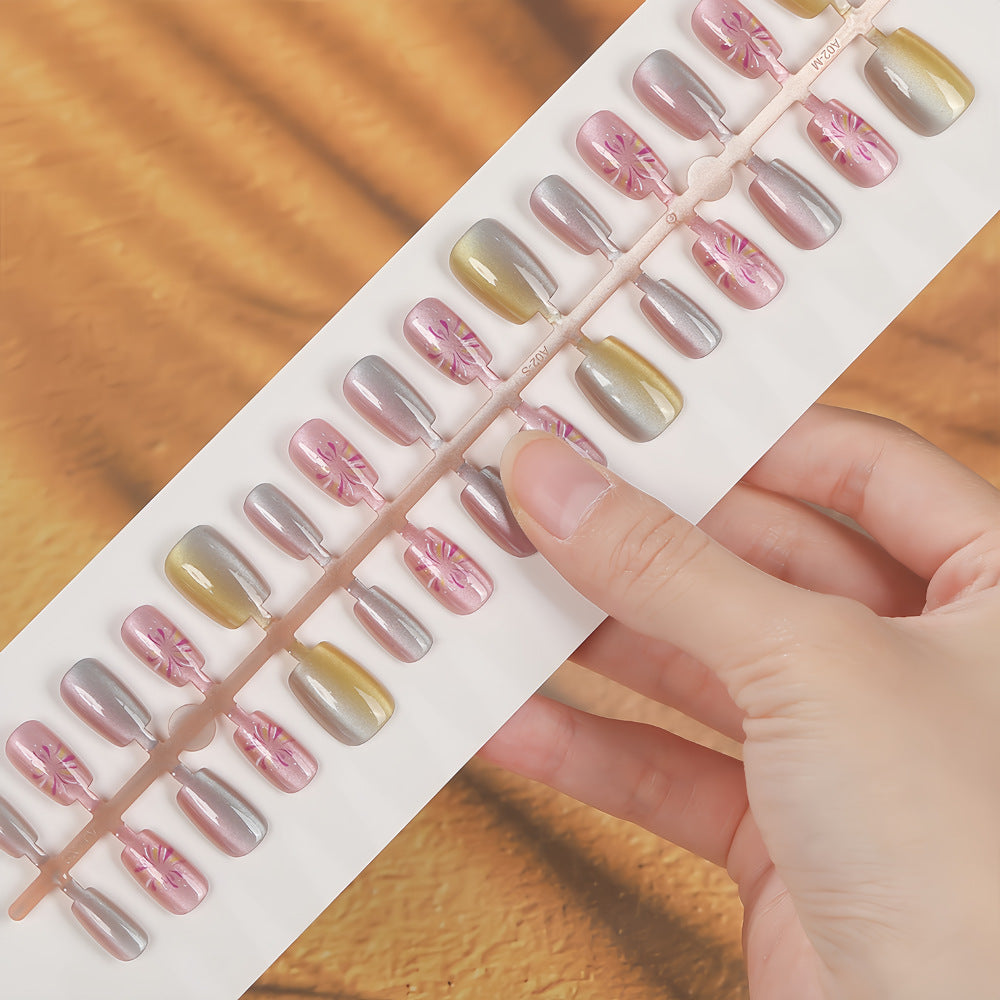 Artificial nails in modern ombre design with floral accents Stornfield