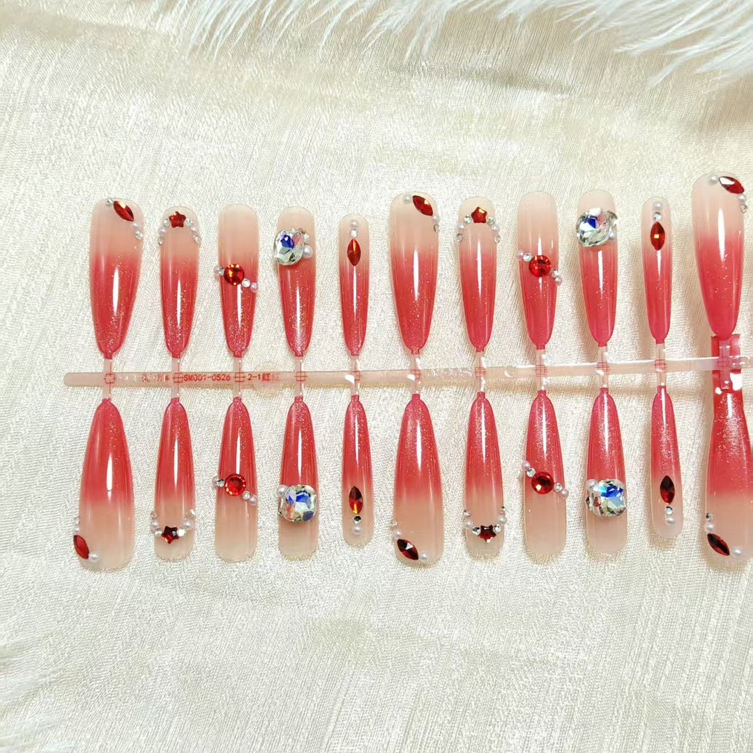 Glamorous artificial nails with sparkling ombre effect and elegant embellishments Stornfield