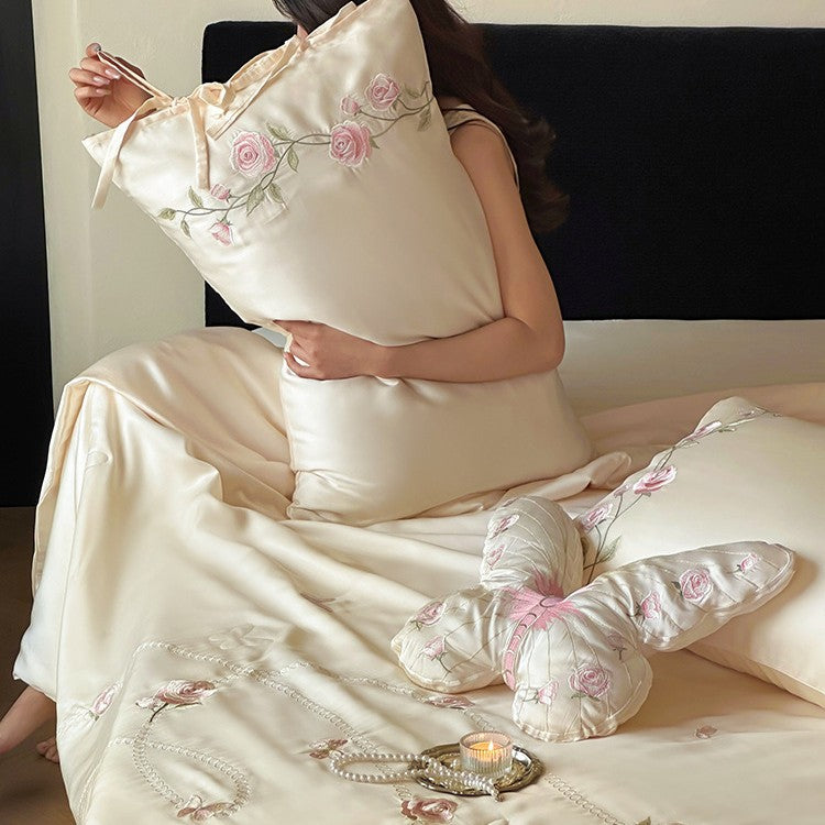 Satin bedding set with embroidered rose vines and shaped butterfly decorative pillow