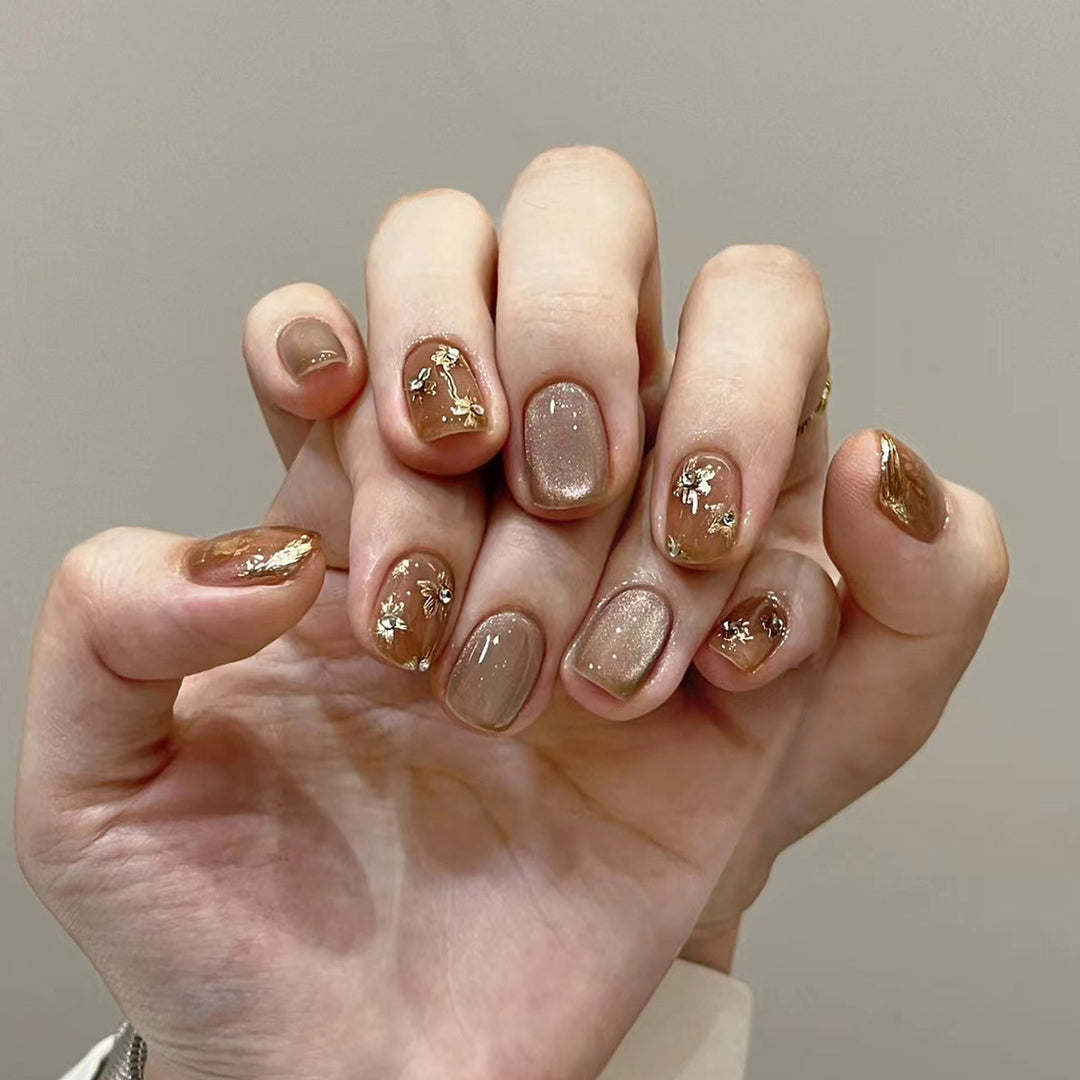Elegant Nail Decoration with Glitter and Floral Accents Stornfield
