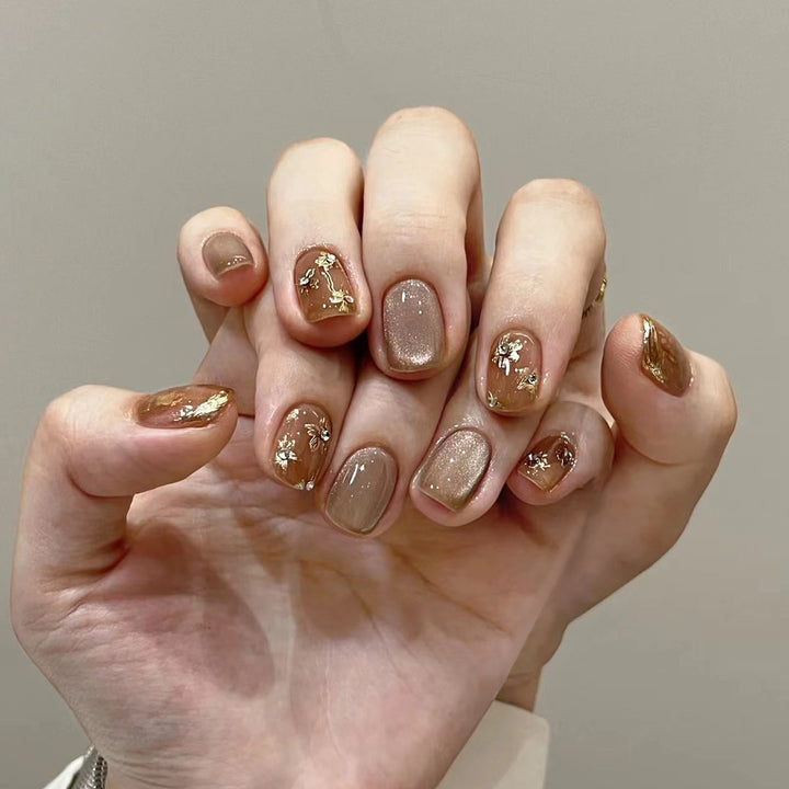 Elegant Nail Decoration with Glitter and Floral Accents Stornfield