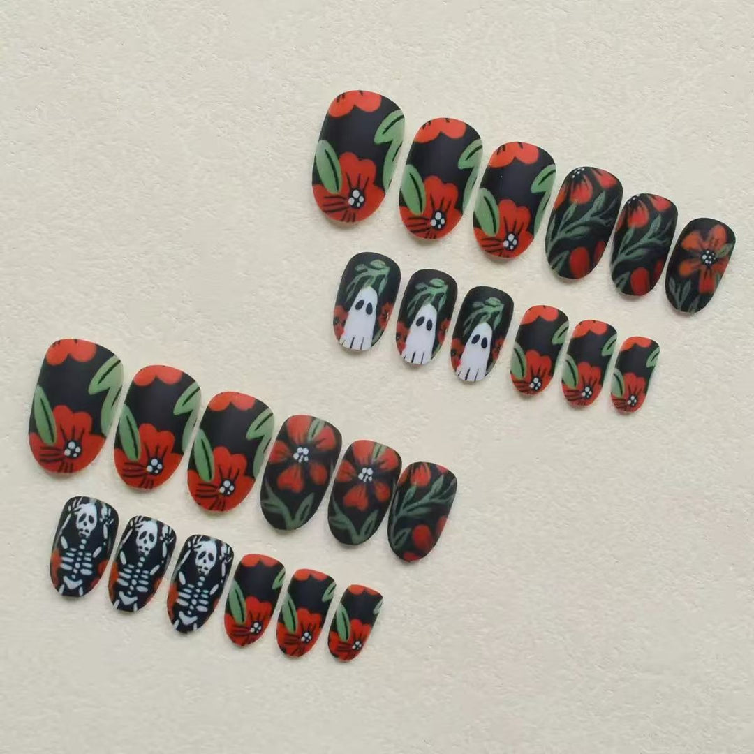 Acrylic nail set with creepy Halloween designs and floral accents Stornfield