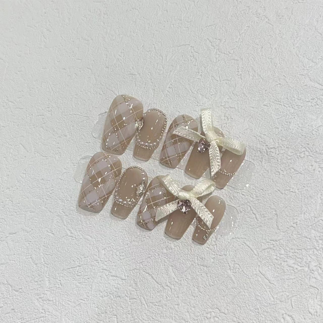 Elegant Press-On Nail Art Set with Ribbons and Gemstone Accents Stornfield