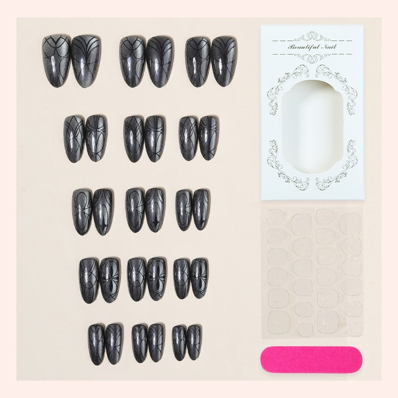 Acrylic nail set with creepy spider design and glitter accents Stornfield