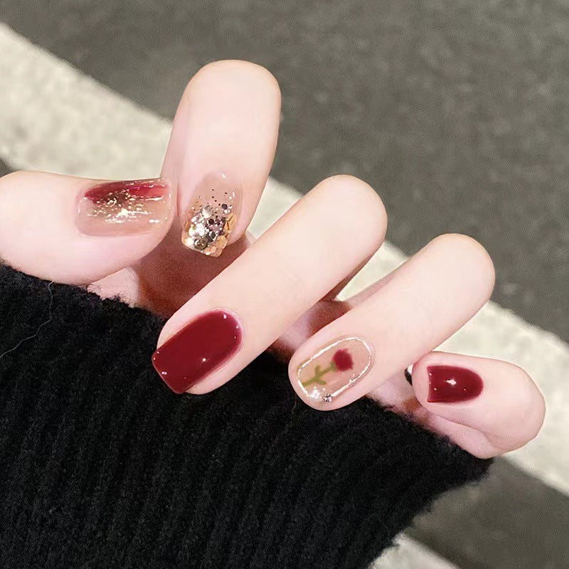 Elegant nail design with floral and sparkling accents Stornfield