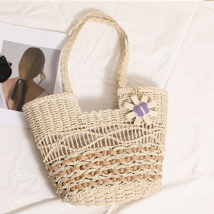 Braided basket bag with decorative flower appliqué Stornfield