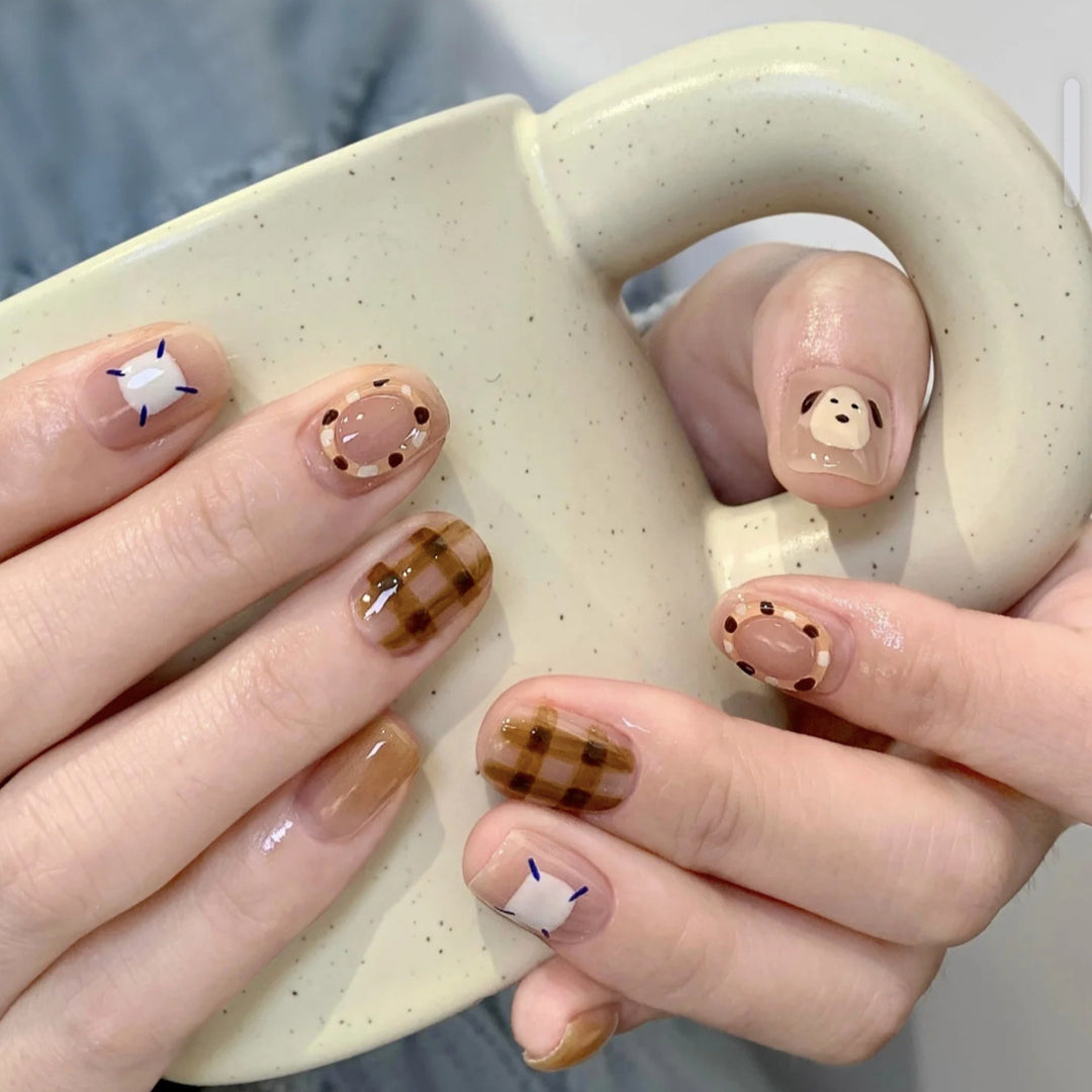 Playful artificial nails with cute animal and pattern accents Stornfield