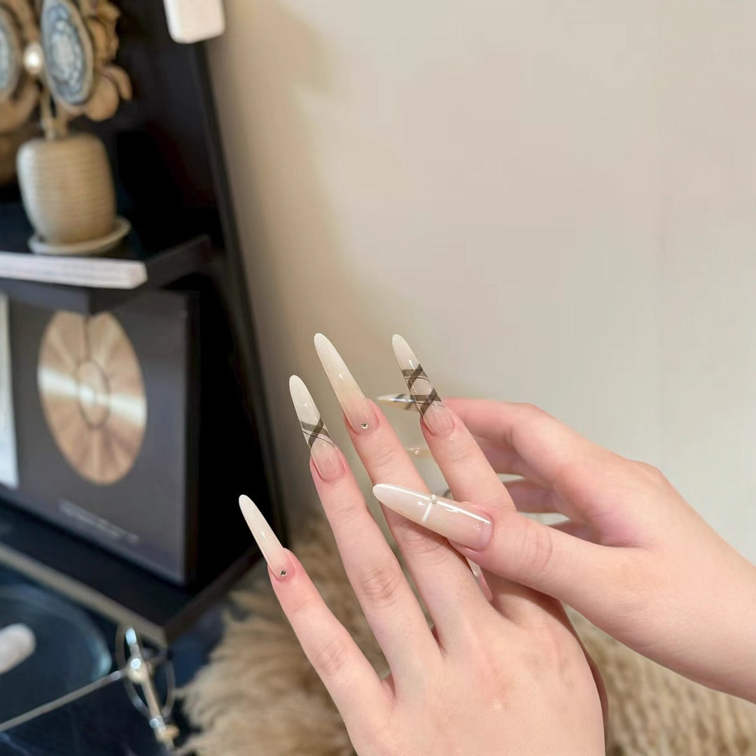 Elegant Stiletto Nail Enhancements with Artistic Accents