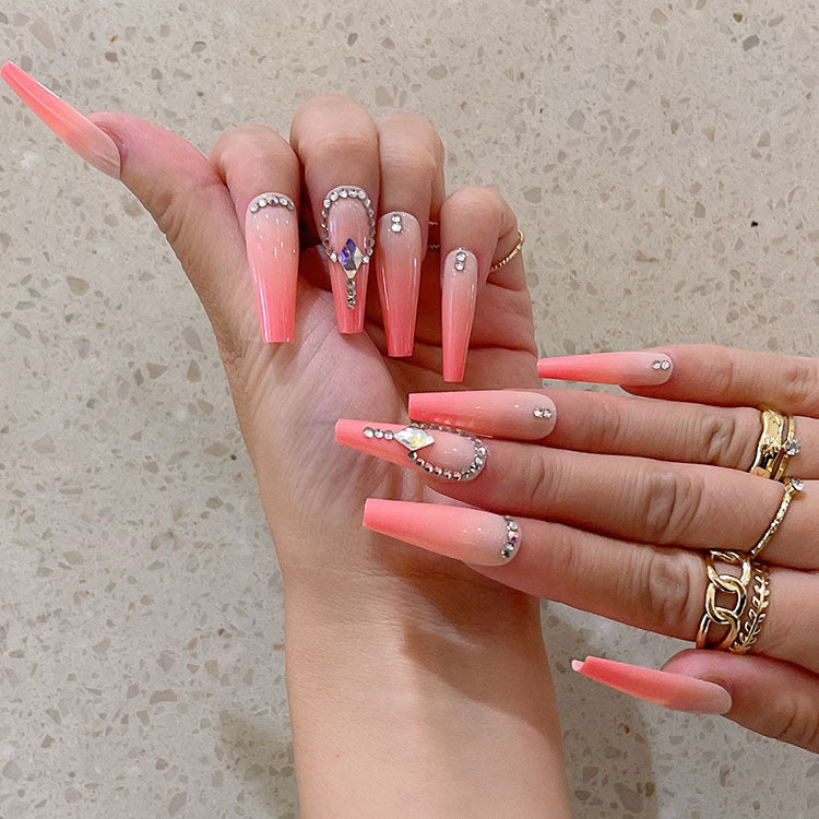 Artificial nails with glitter and stone embellishments Stornfield