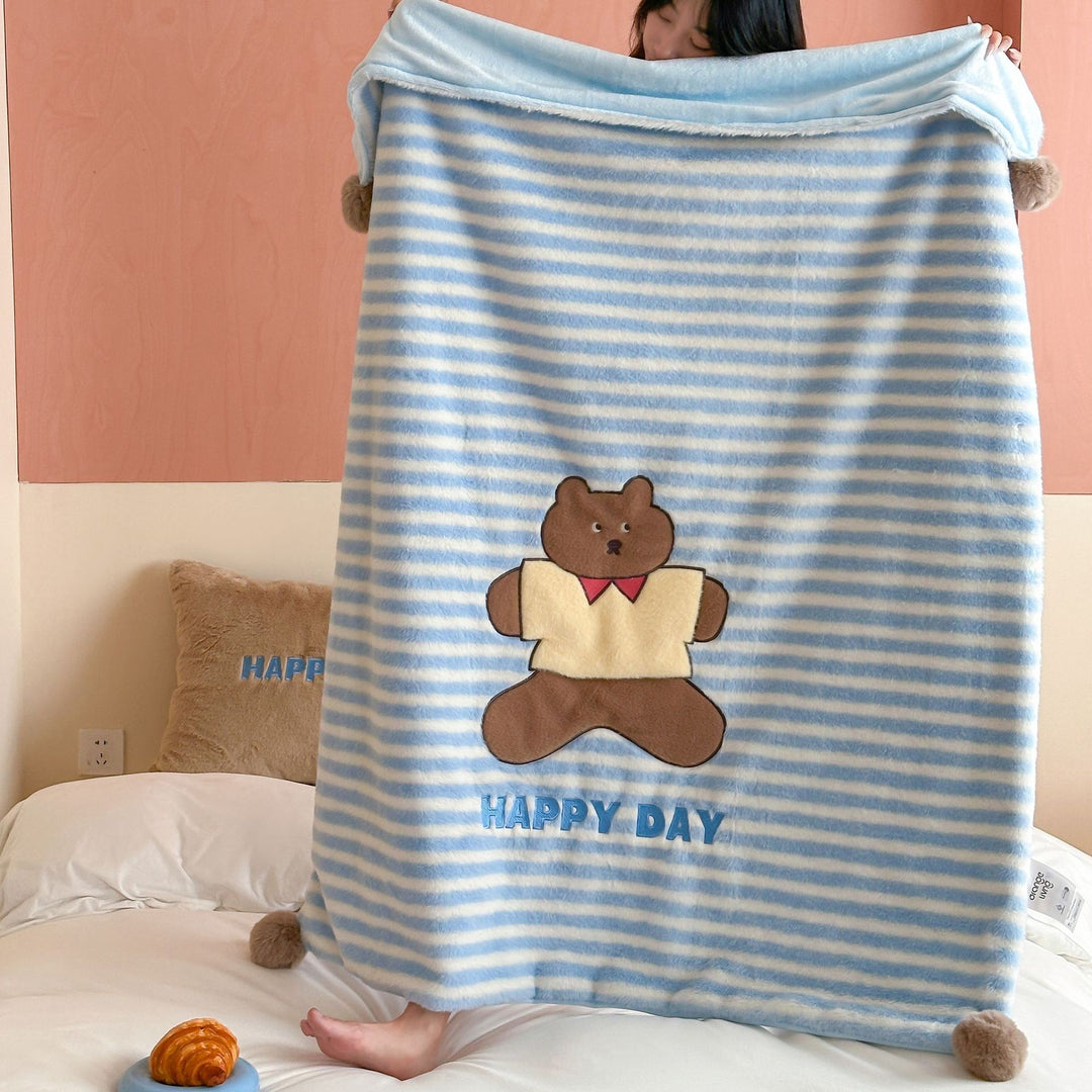 Reversible cuddly blanket made of teddy fleece and microfleece with floral pattern and fastening straps