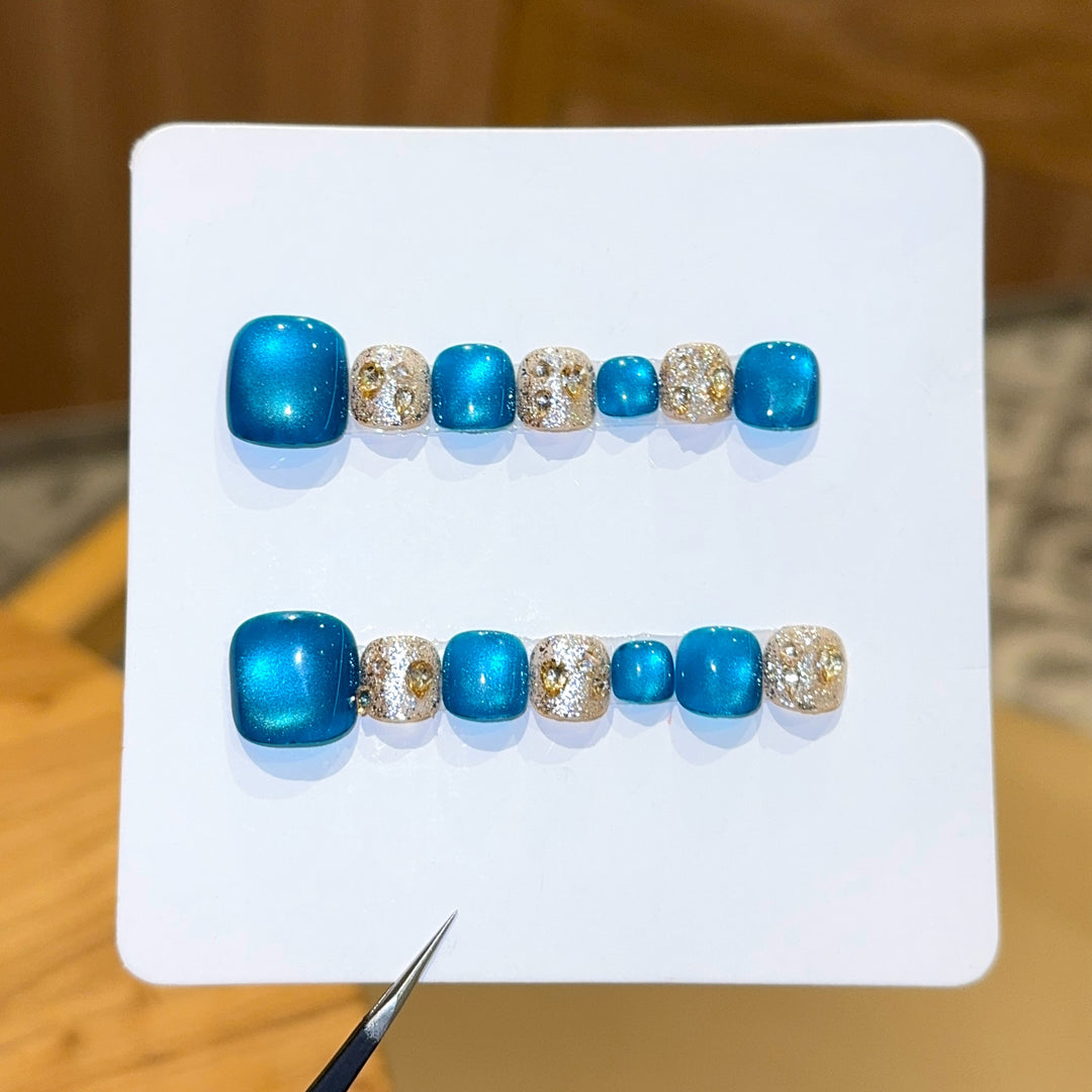 Art Nail Design with Shimmering Accents and Sparkling Rhinestone Details Stornfield