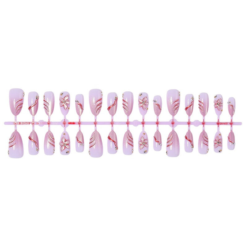 Acrylic nail set with elegant flower and glitter patterns Stornfield