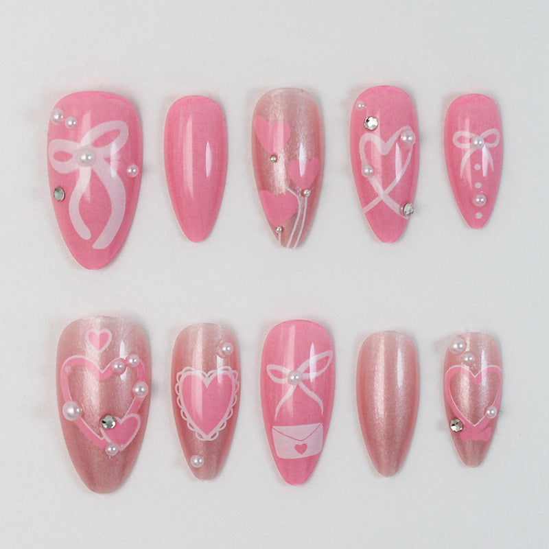 Premium artificial nail set with romantic heart and bow designs Stornfield