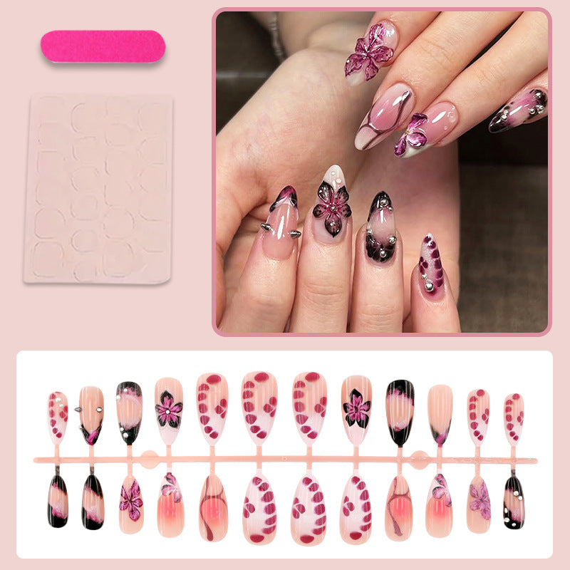 Acrylic nail set with elegant floral design and glossy accents Stornfield