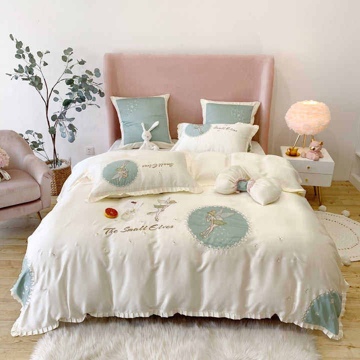 Satin bedding set with fairy embroidery, ruffled hem and decorative pillowcases