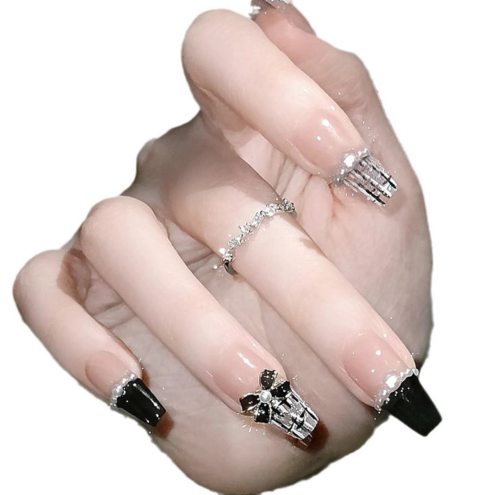 Glamorous artificial fingernails with glitter and moon designs Stornfield