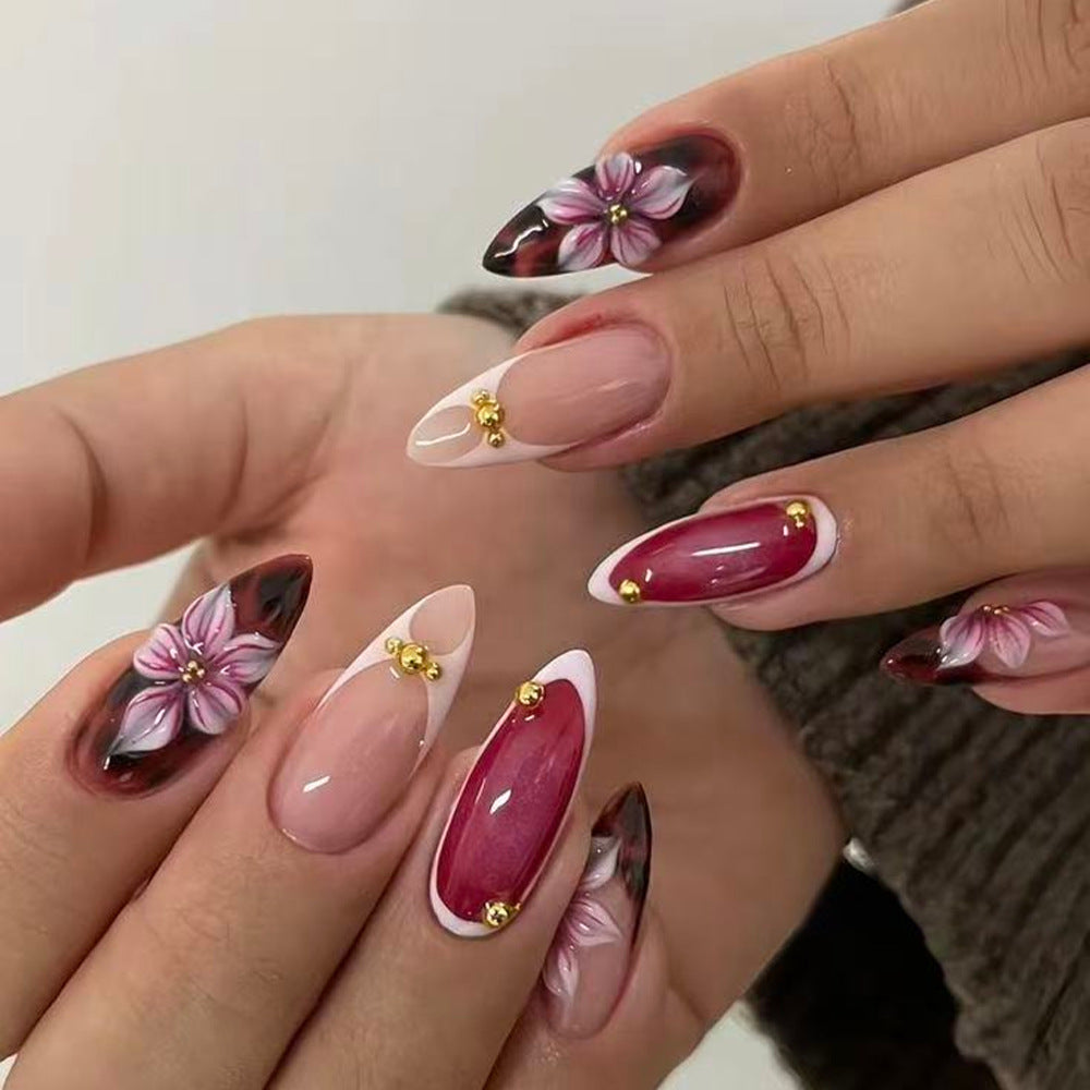Artificial nails with floral 3D designs and elegant accents Stornfield