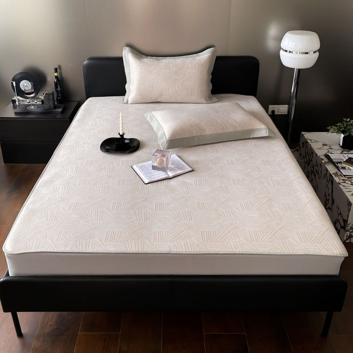 Quilted mattress topper with jacquard pattern and non-slip base