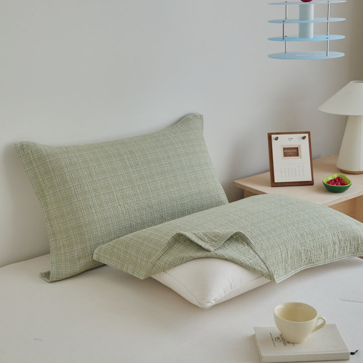 Textured cushion cover set made of cotton-linen blend with waffle structure