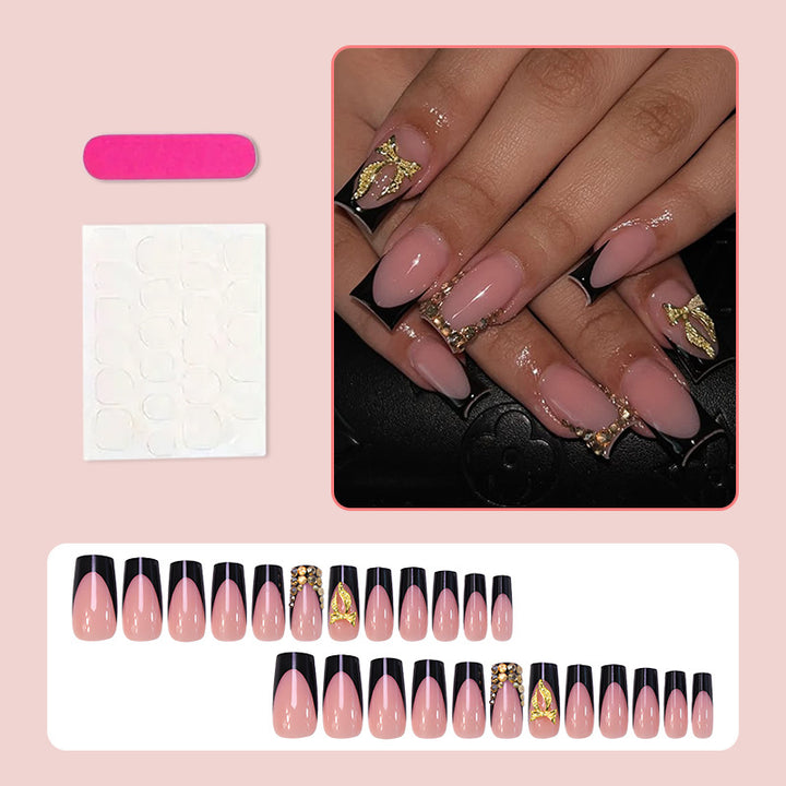 Artificial nail set with elegant gold decoration and stylish black Stornfield