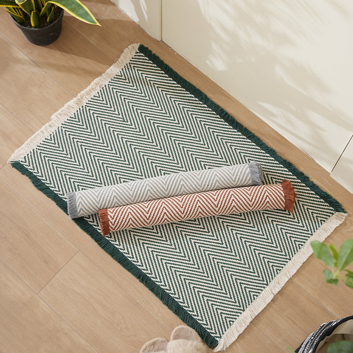 Handwoven cotton bath mat with herringbone pattern and fringes Stornfield