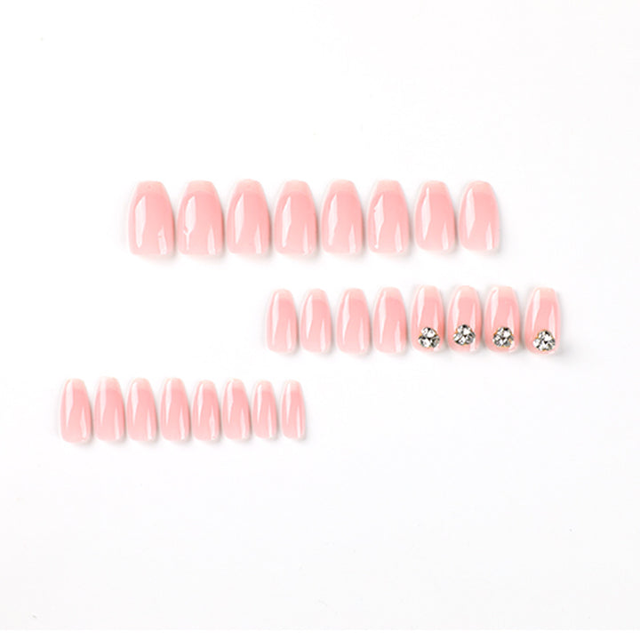 Artful nail extensions with elegant French tip and rhinestone embellishments Stornfield