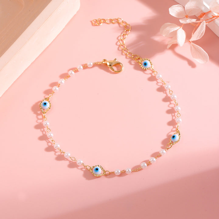 Elegant Pearl and Eye Charm Necklace Stornfield
