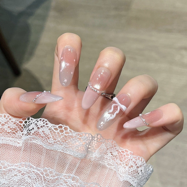 Artistic Stiletto Press-On Nail Art with Glimmering Accents Stornfield
