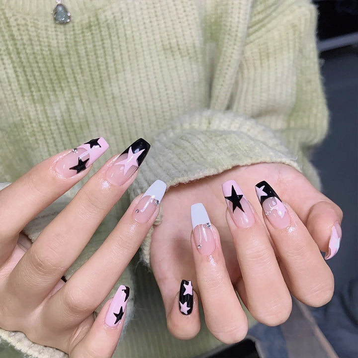 Artificial nail set with glamorous star design and sparkling accents Stornfield