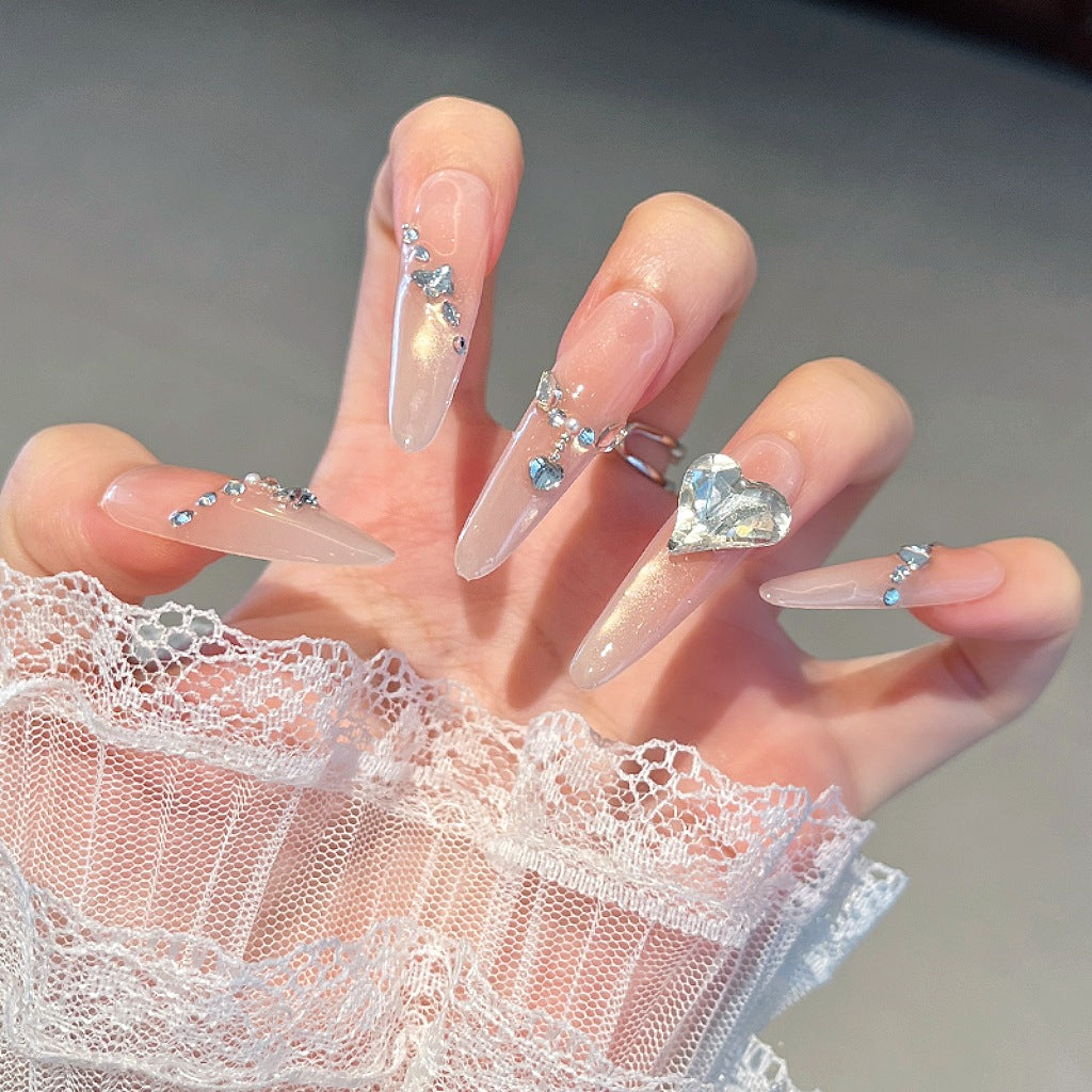 Artistic Stiletto Press-On Nail Art with Glimmering Accents Stornfield