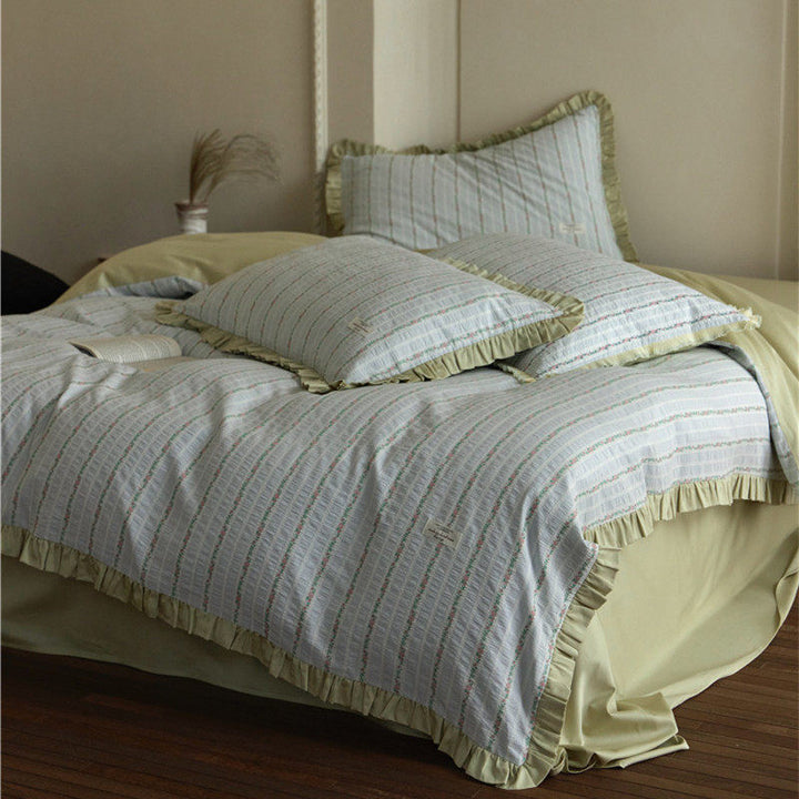 Bedding set with fine striped texture, ruffled border and breathable cotton blend