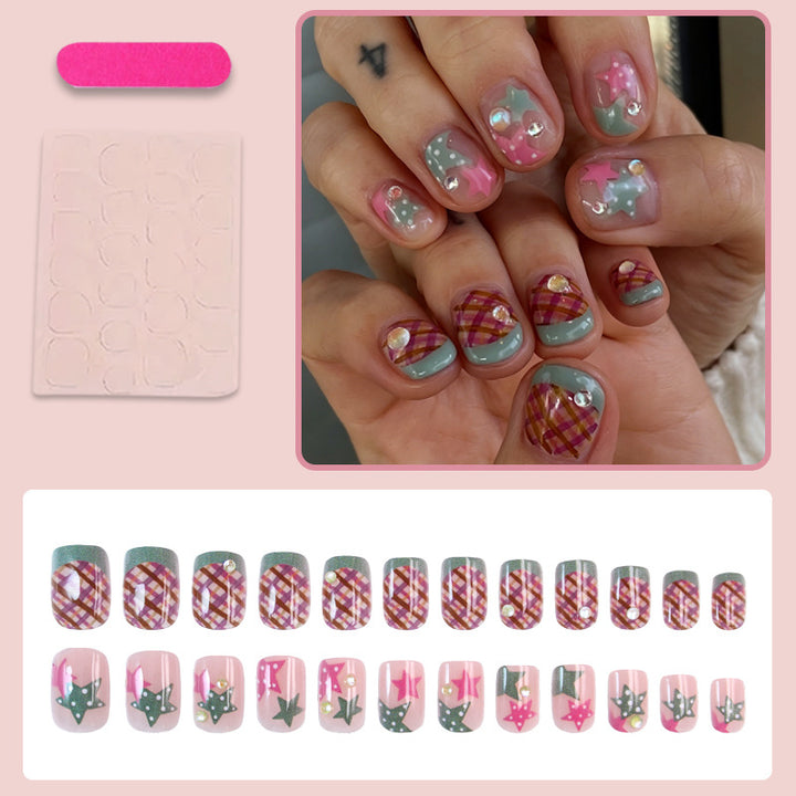 Artificial nail set with playful geometric designs and glitter accents Stornfield