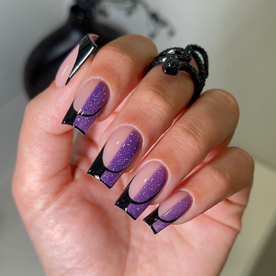 Artful nail extensions with glamorous color gradient and glitter details Stornfield