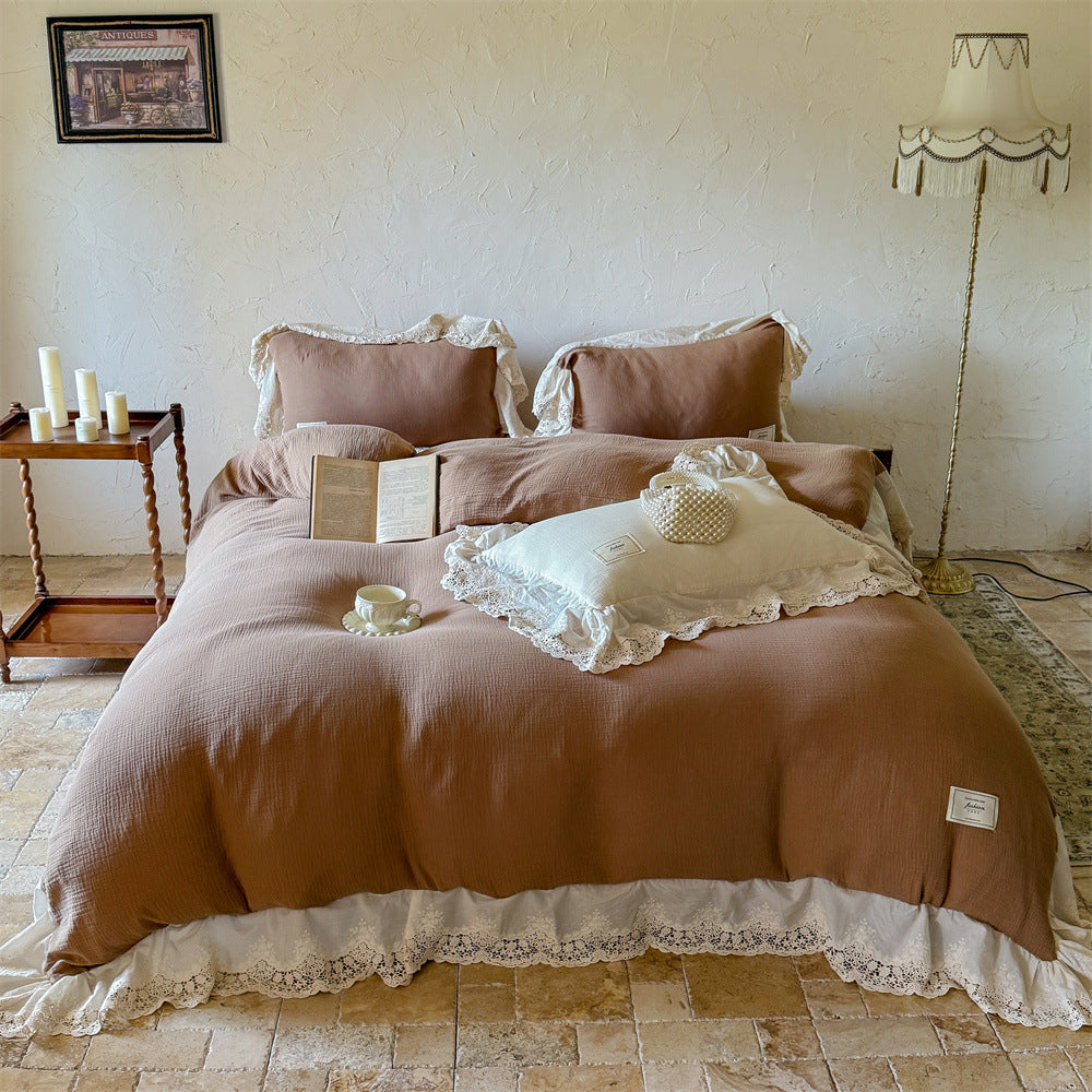 Vintage-inspired cotton muslin bedding set with wide lace ruffle and reversible function