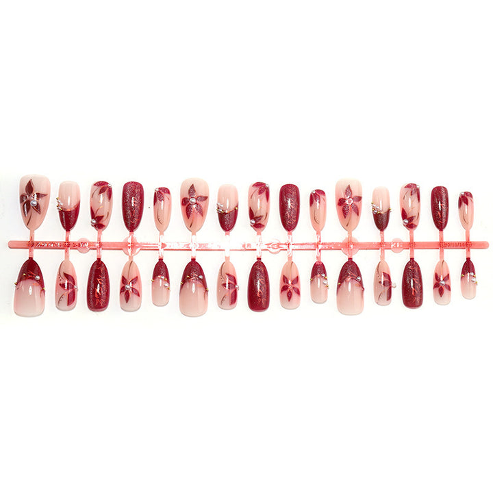 Glamorous artificial nail set with elegant floral and glitter details Stornfield
