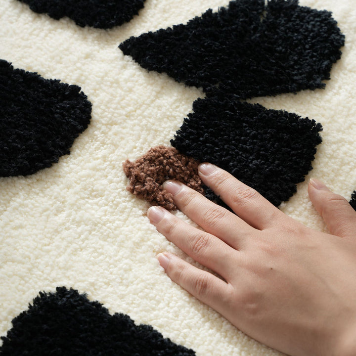 Tufted bathroom mat in abstract leopard pattern with soft high pile Stornfield